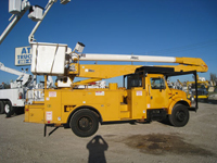 Bucket trucks with dual fuel tanks.