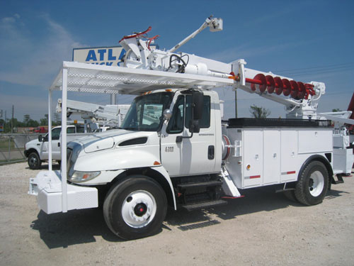 Digger derrick with pole claws.