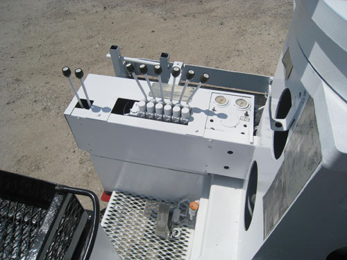 Digger truck with dual stand up controls.
