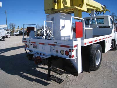 Ridding conloel on digger truck.