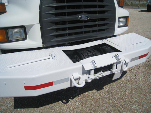 Front hydraulic winch on digger truck.