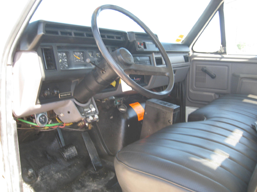 Digger truck with bench seat.