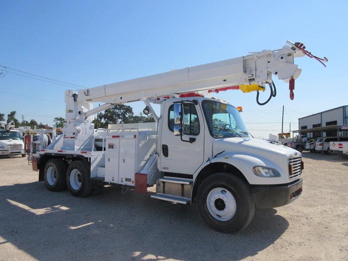 Digger with material handler.