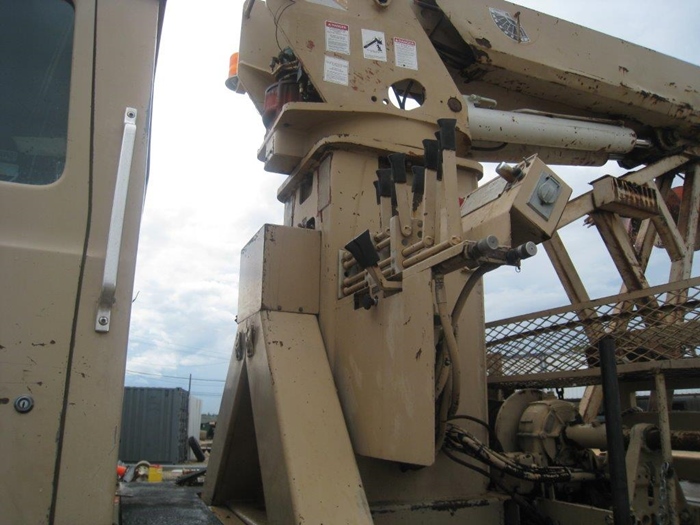 Stand up controls on digger truck.