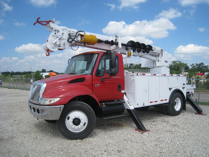 Digger truck with Auger and Pole Claws.