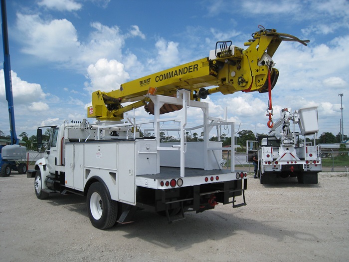 Boom tip winch on digger truck.