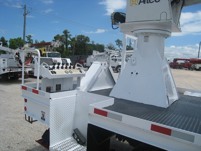 Rear center mount controls digger truck.