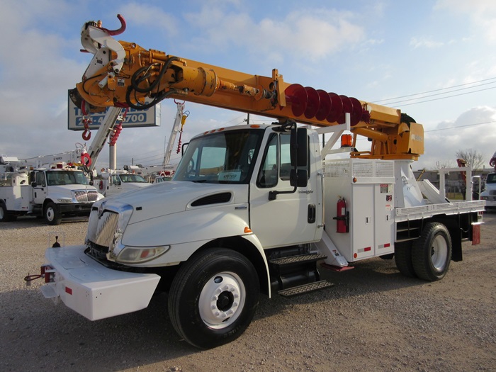 Digger truck with pole claws.