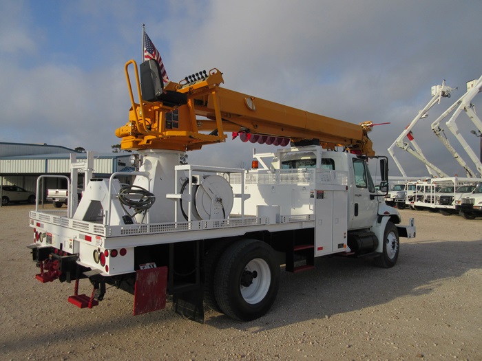 Digger truck with hose reel.