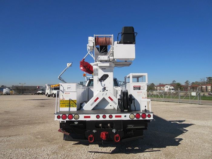 Digger truck with hose reel.