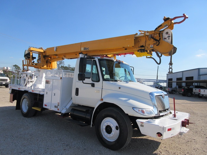 Digger truck with front bumper winch.