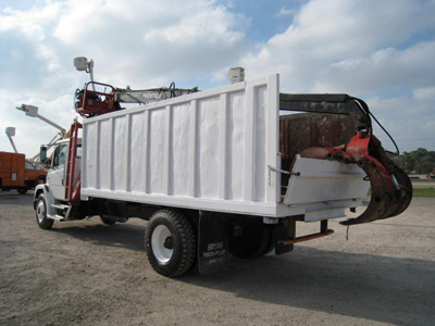 Dump truck with loader.