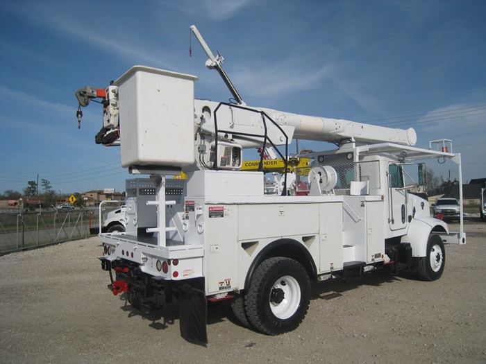 Bucket truck with material handler.