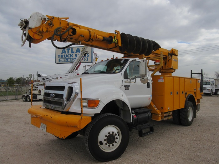 Auger digger truck.