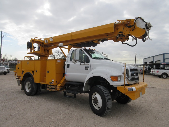 Pole claws on digger truck.